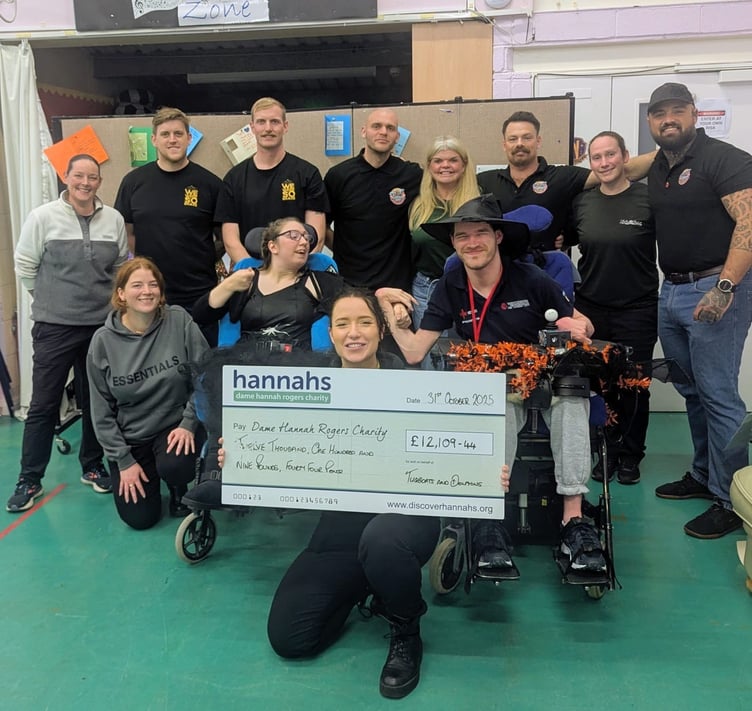 Tugboats and Dolphins hand over a cheque to Dame Hannahs after a year of fundraising.